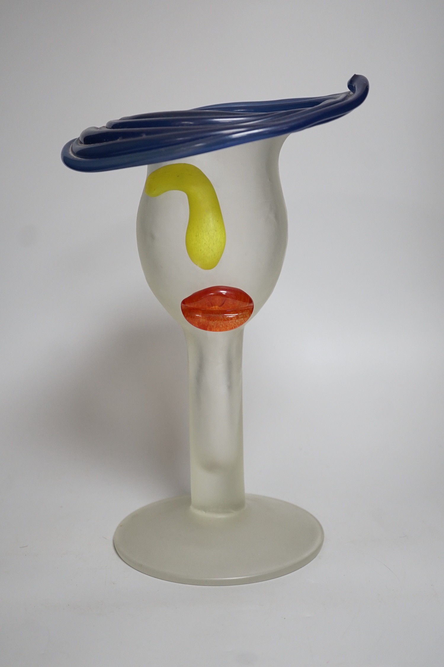 A novelty multi coloured head shaped studio glass vase, height 33cms